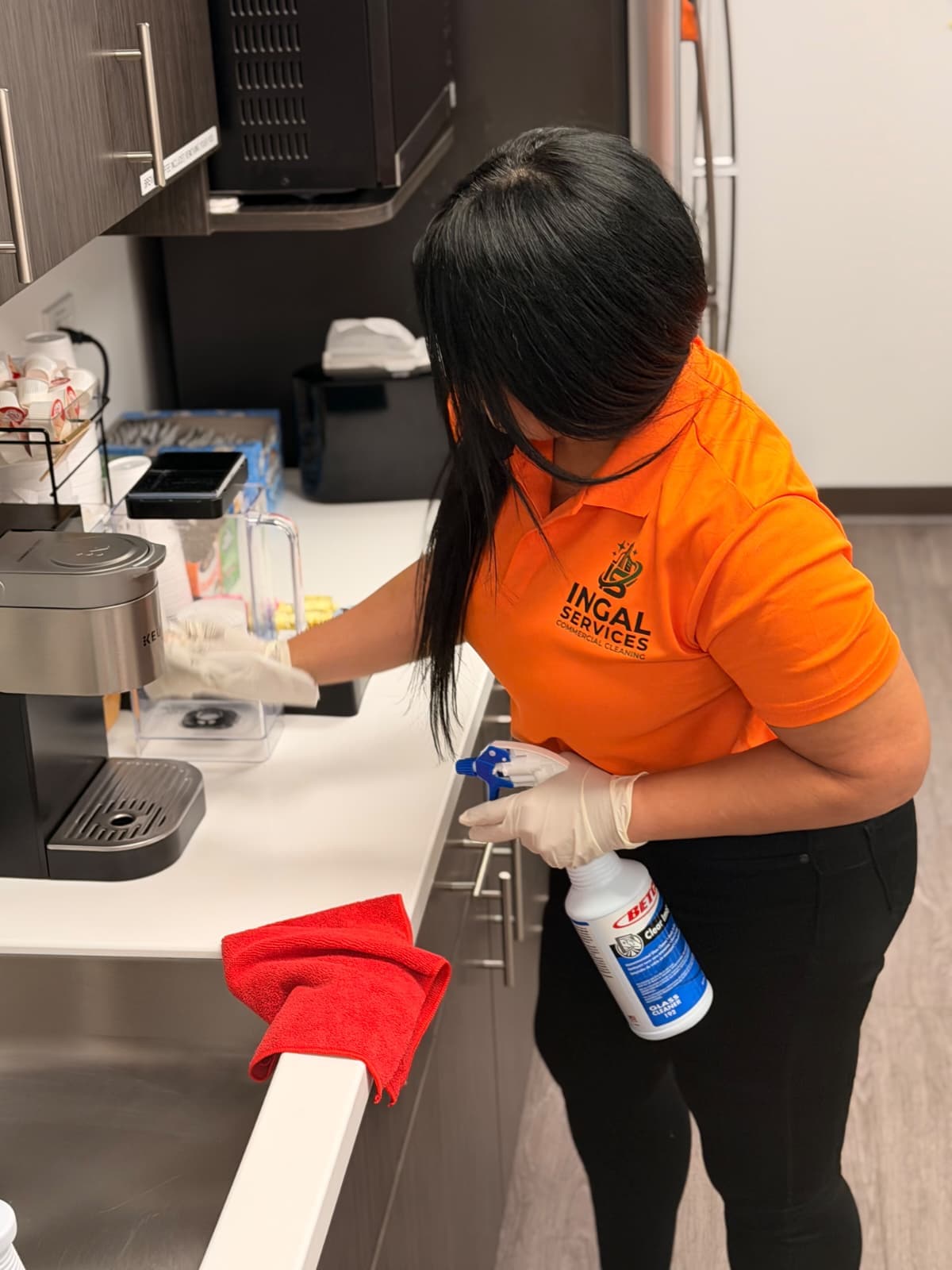 INGAL SERVICES INC employee disinfecting a breakroom coffee station