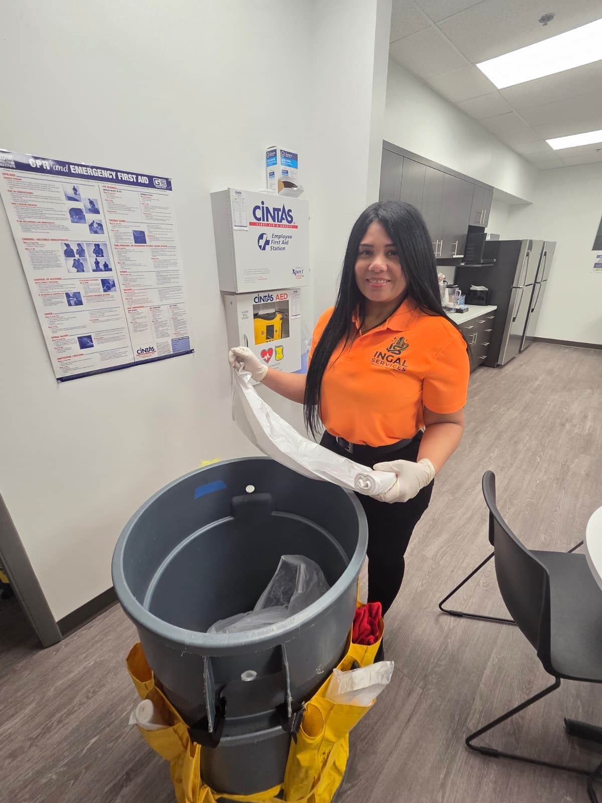 INGAL SERVICES INC employee preparing a barrel cart beside the employee first aid station