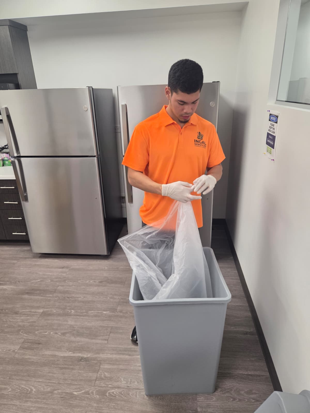 INGAL SERVICES INC employee replacing a waste liner in an office breakroom